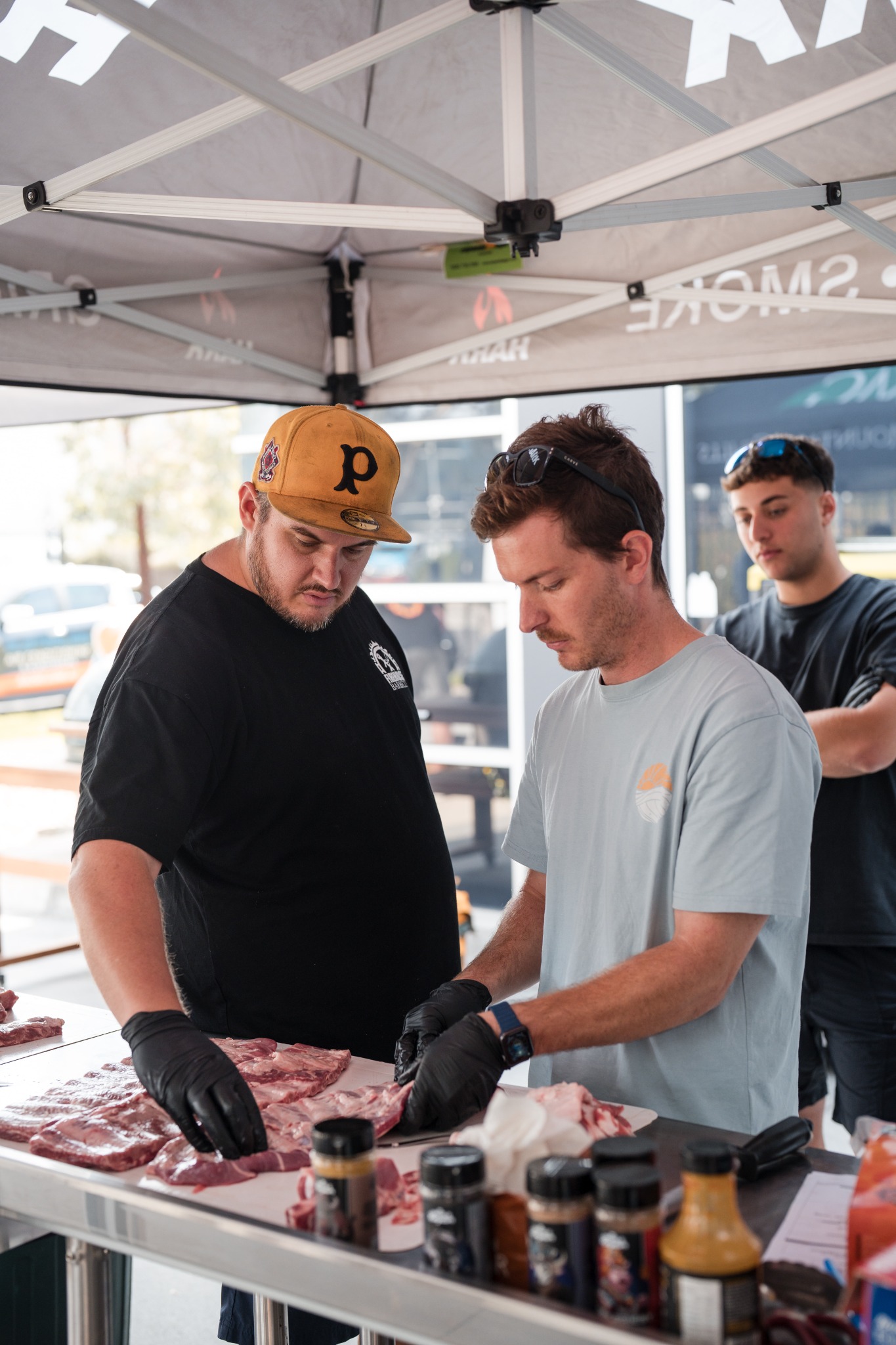 Ross guiding a participant through food preparation