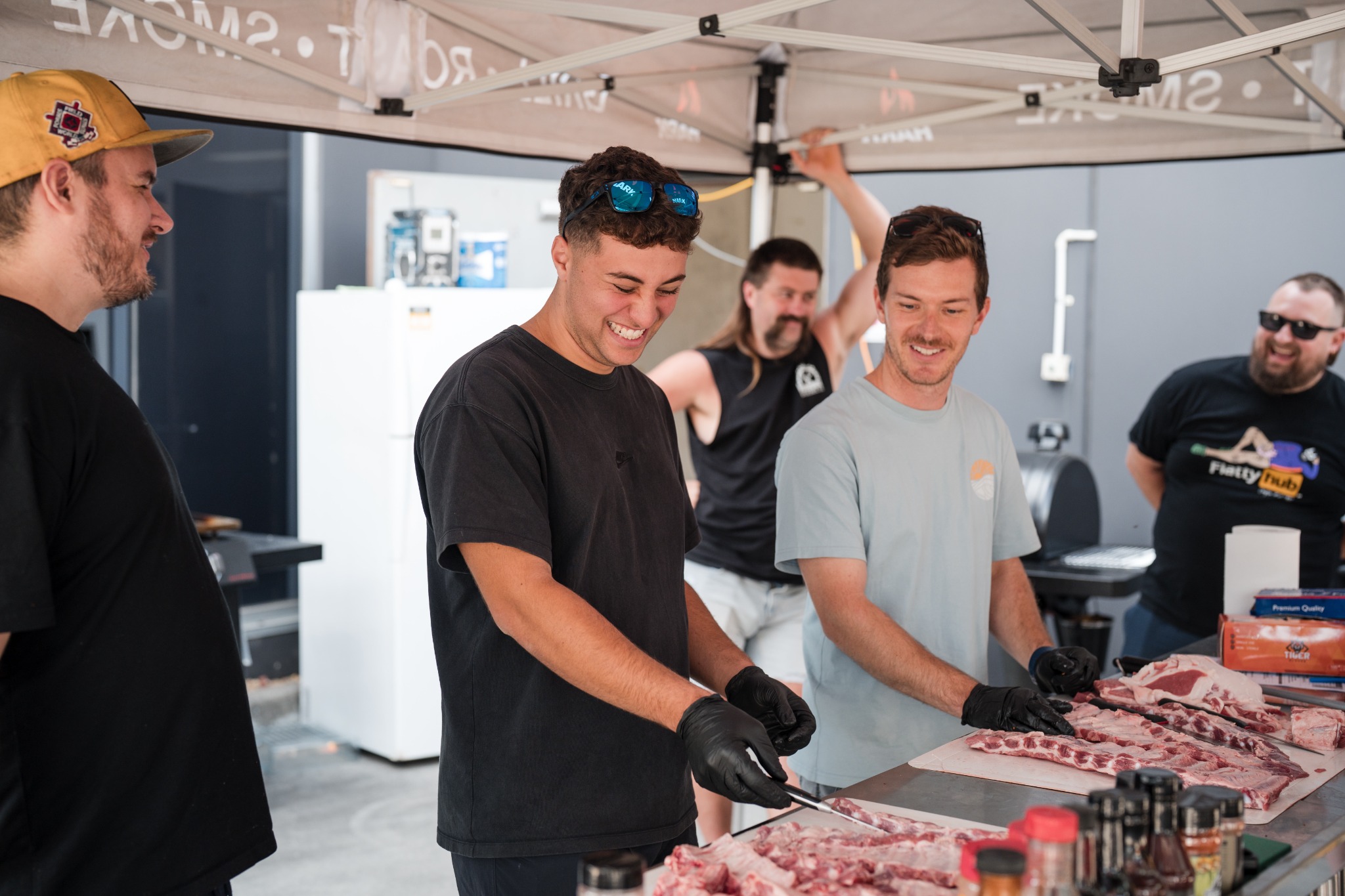 Smoke School participants preparing meat together
